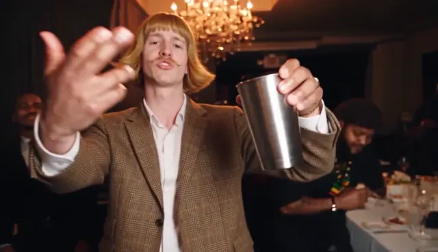 Burning Bridges AI video: the lead raises a silver cup toward the camera